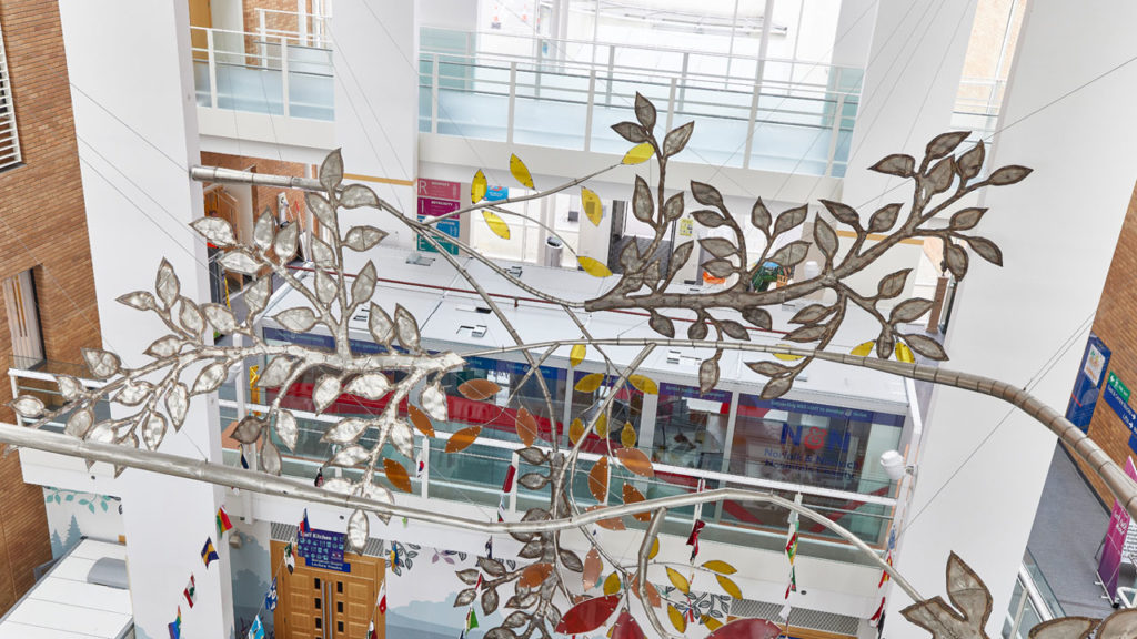 Building within building, NHS office pod in hospital atrium