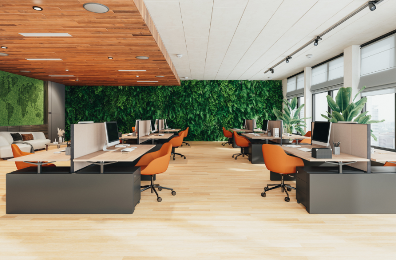 An office with orange chairs and greenery showcasing how these can boost mental well-being in the office