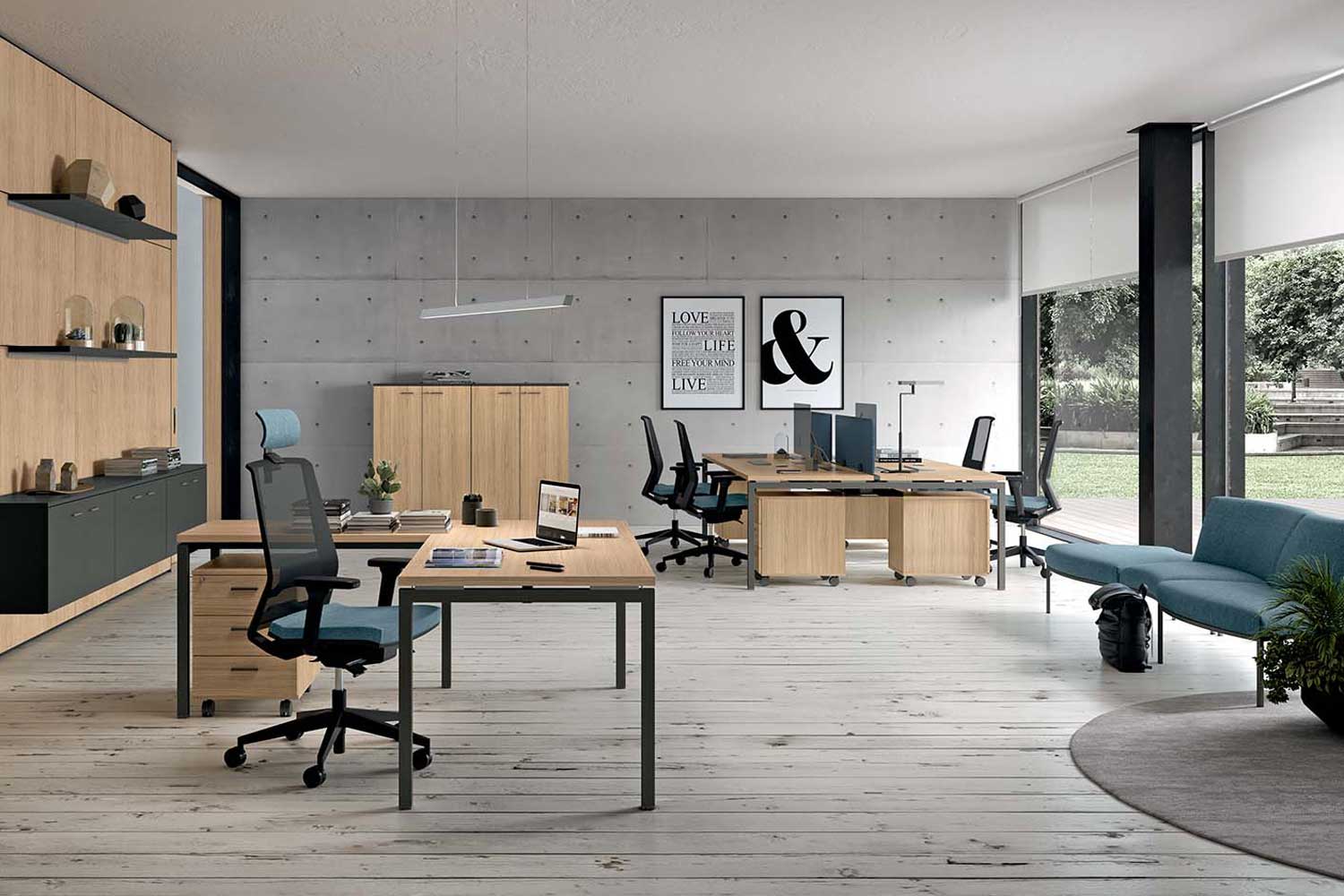 An image of a grey office with Idea+ 01 oak desks and blue and black office chairs