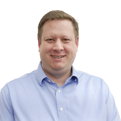 A male colleague with blue shirt and white background.
