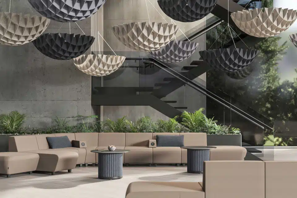 Brown and grey acoustic clouds hanging from the ceiling.