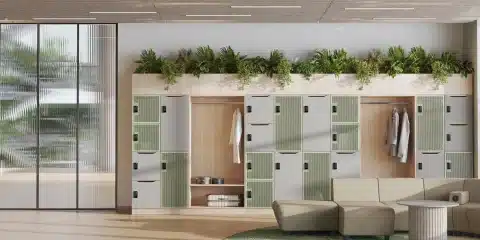 Modular office lockers with olive green doors, wood-effect top panels, and integrated planters.