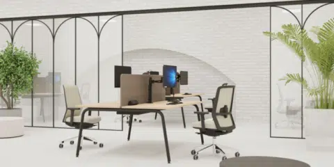 A office room wit sit stand desks and chairs.