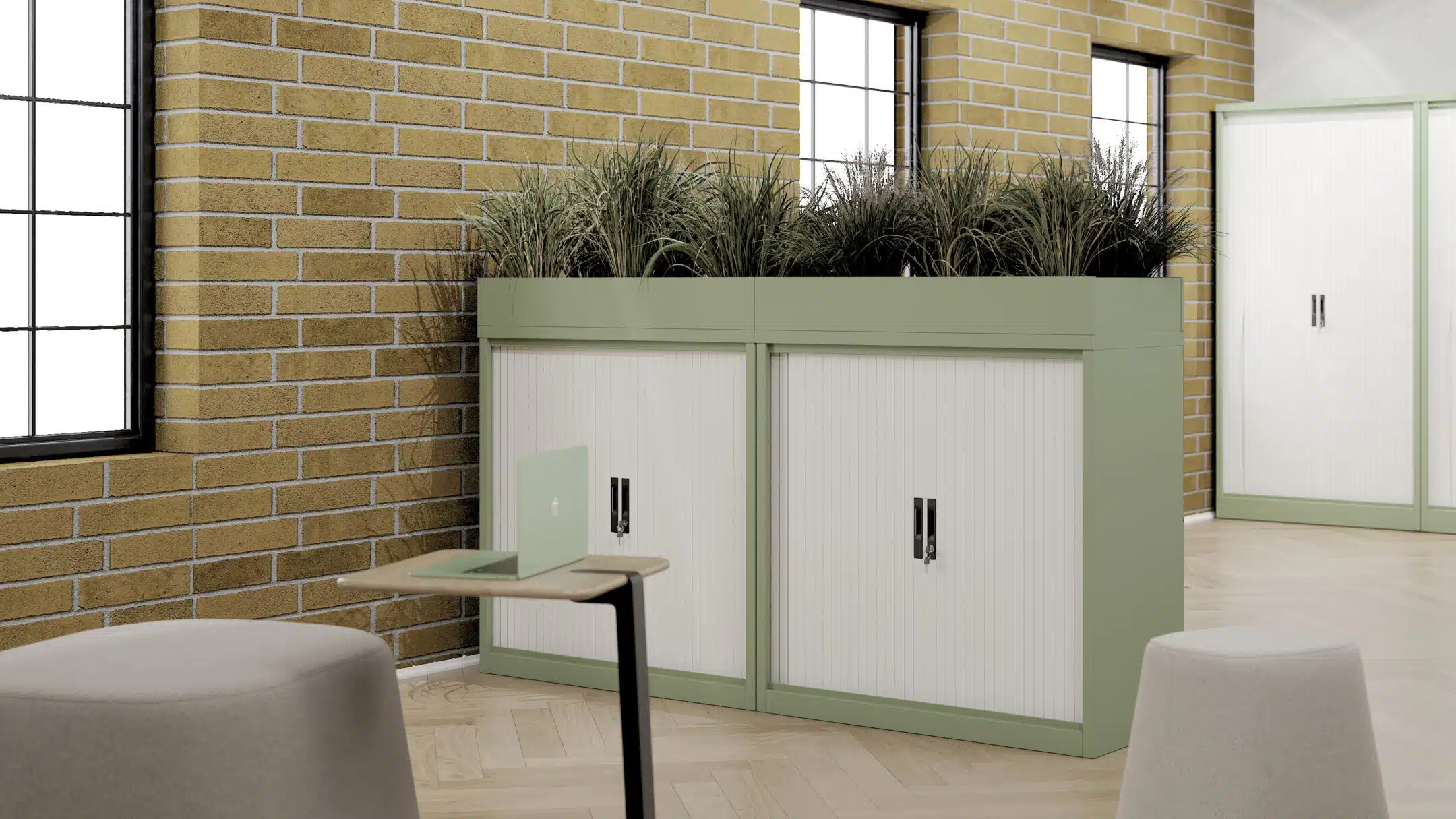 A green and white steel storage cabinets in a spacious and light office.