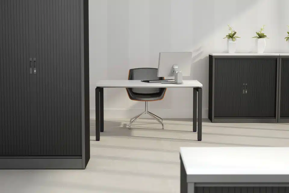 Black steel storage tambours in a spacious and light office.
