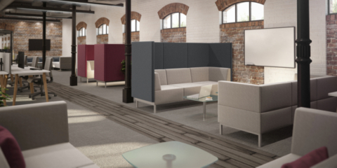 A room full of modular dark blue, burgundy and white high back sofas.