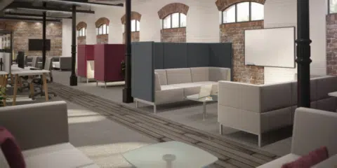 A room full of modular dark blue, burgundy and white high back sofas.