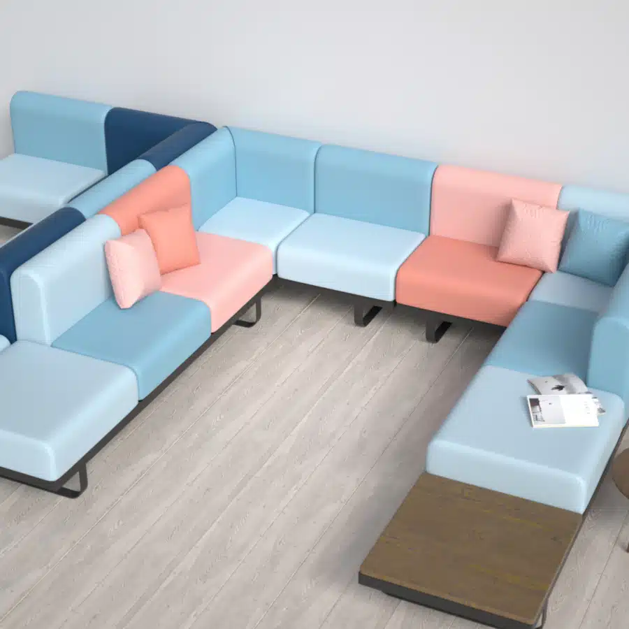A modular pink, light and dark blue colour that is placed next to a wall.
