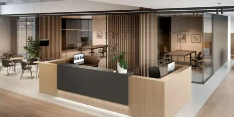 A larger dark brown reception table in a room that has wooden style panels on the wall.