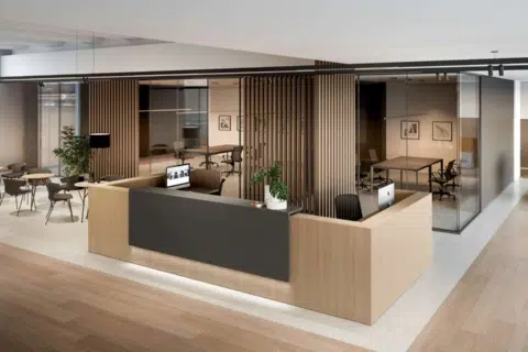 A larger dark brown reception table in a room that has wooden style panels on the wall.