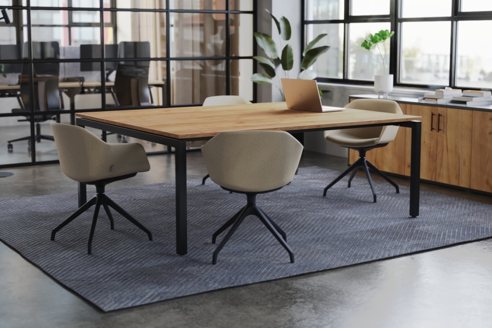 Modern Boardroom with Long Table, Window, and Plant.