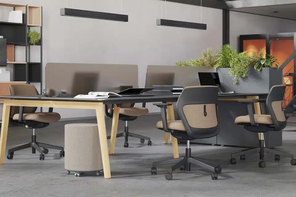 A room with wooden desks and office chairs.