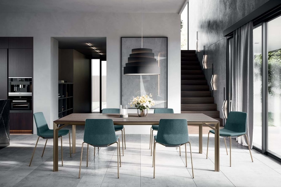 A bright, open-plan boardroom featuring light blue boardroom chairs.