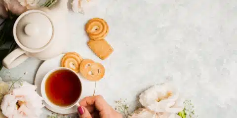 English tea placed on a table with biscuits.