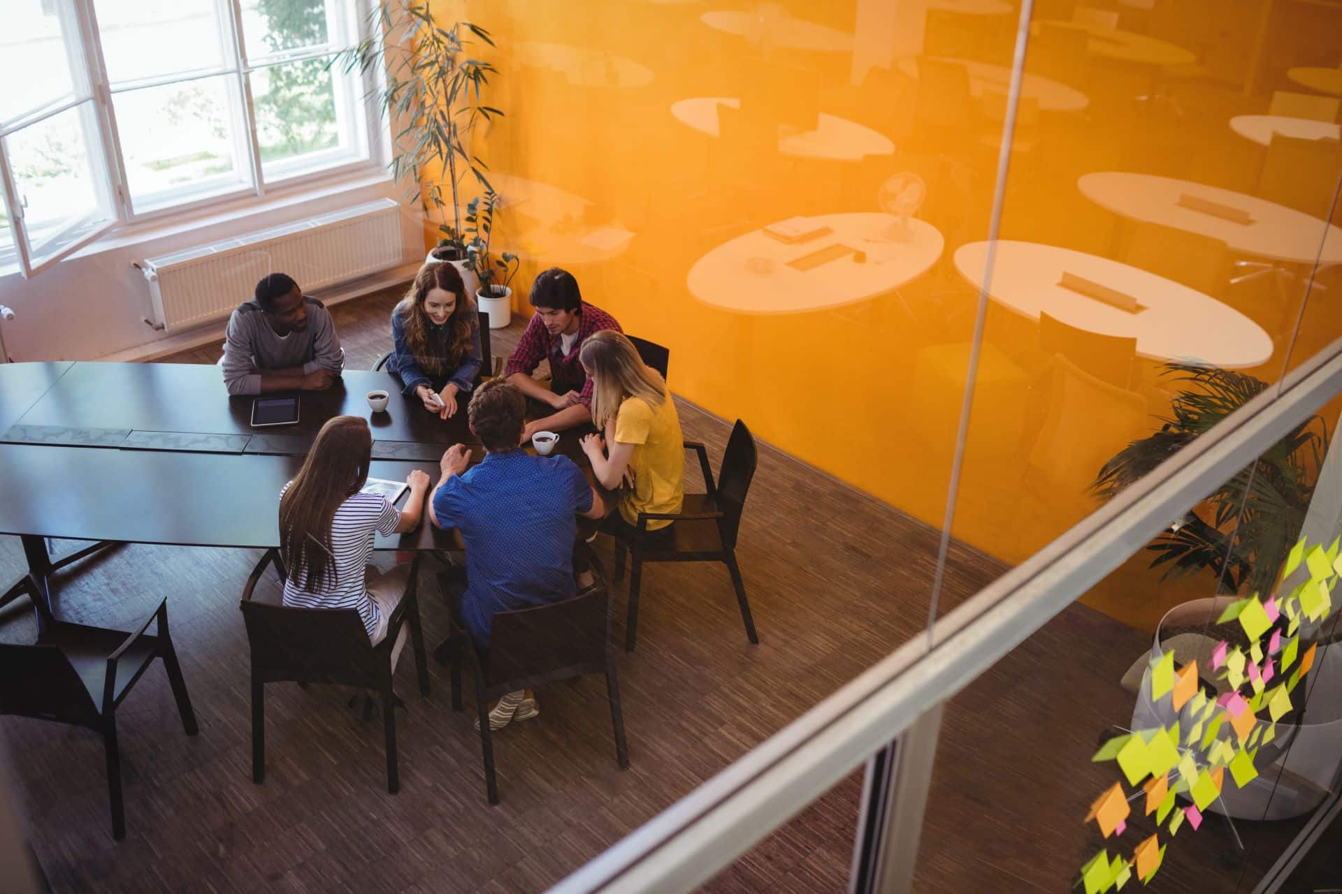 Business executives interacting with each other in the office space.