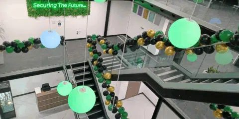 A room with an industrial style staircase in front.v