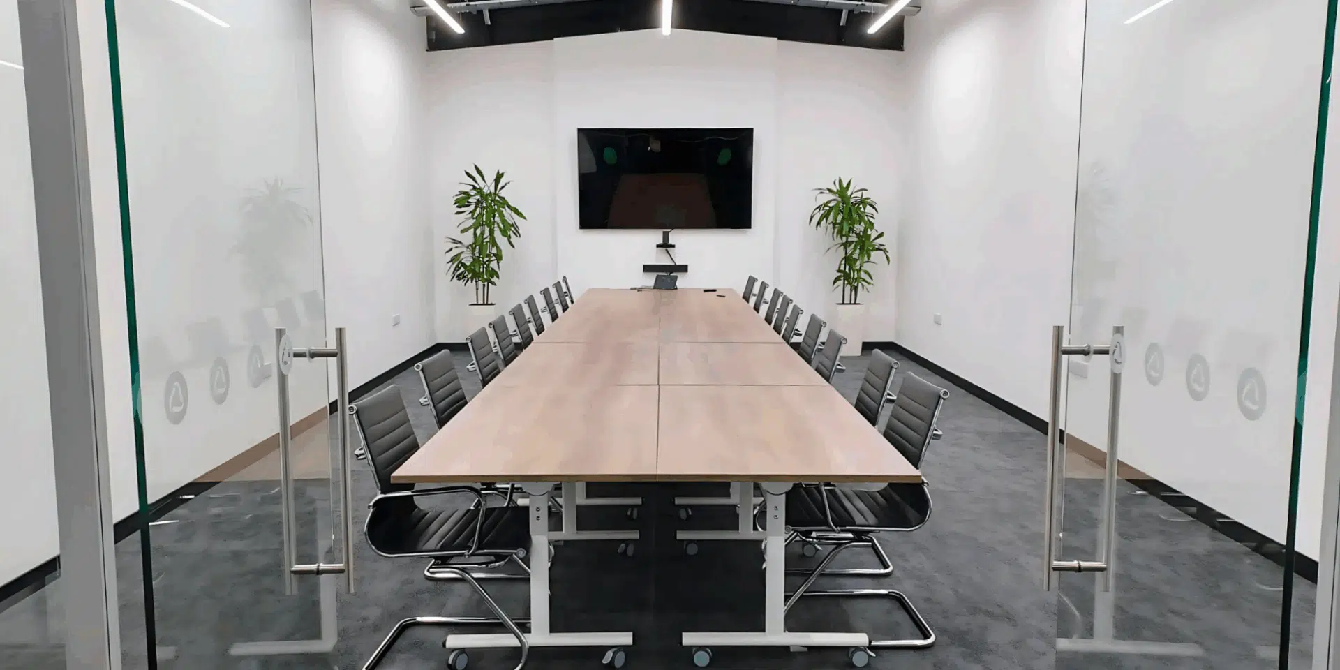 Boardroom with a large table and chairs.