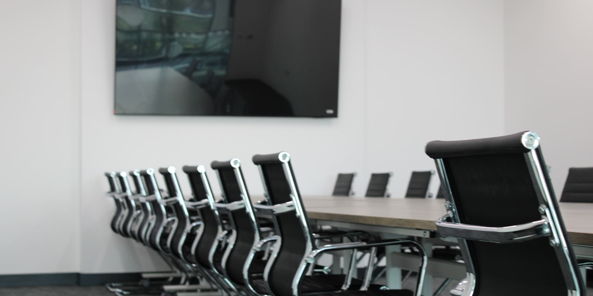 An office room with boardroom chairs.