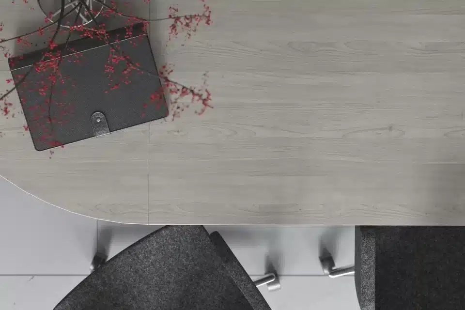 A meeting table with a notepad on it.