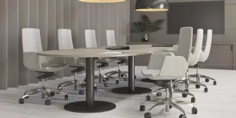 A large meeting table in a room.