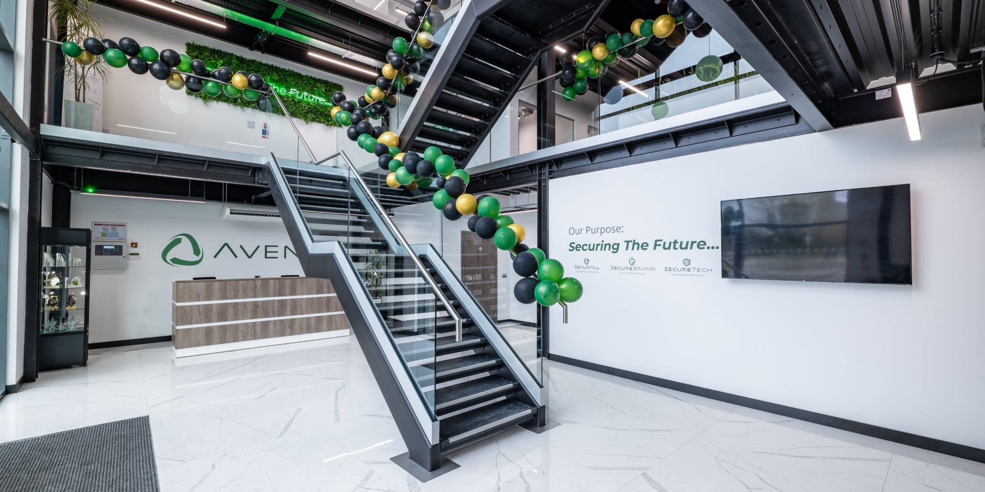 A reception room with an industrial style staircase in front.