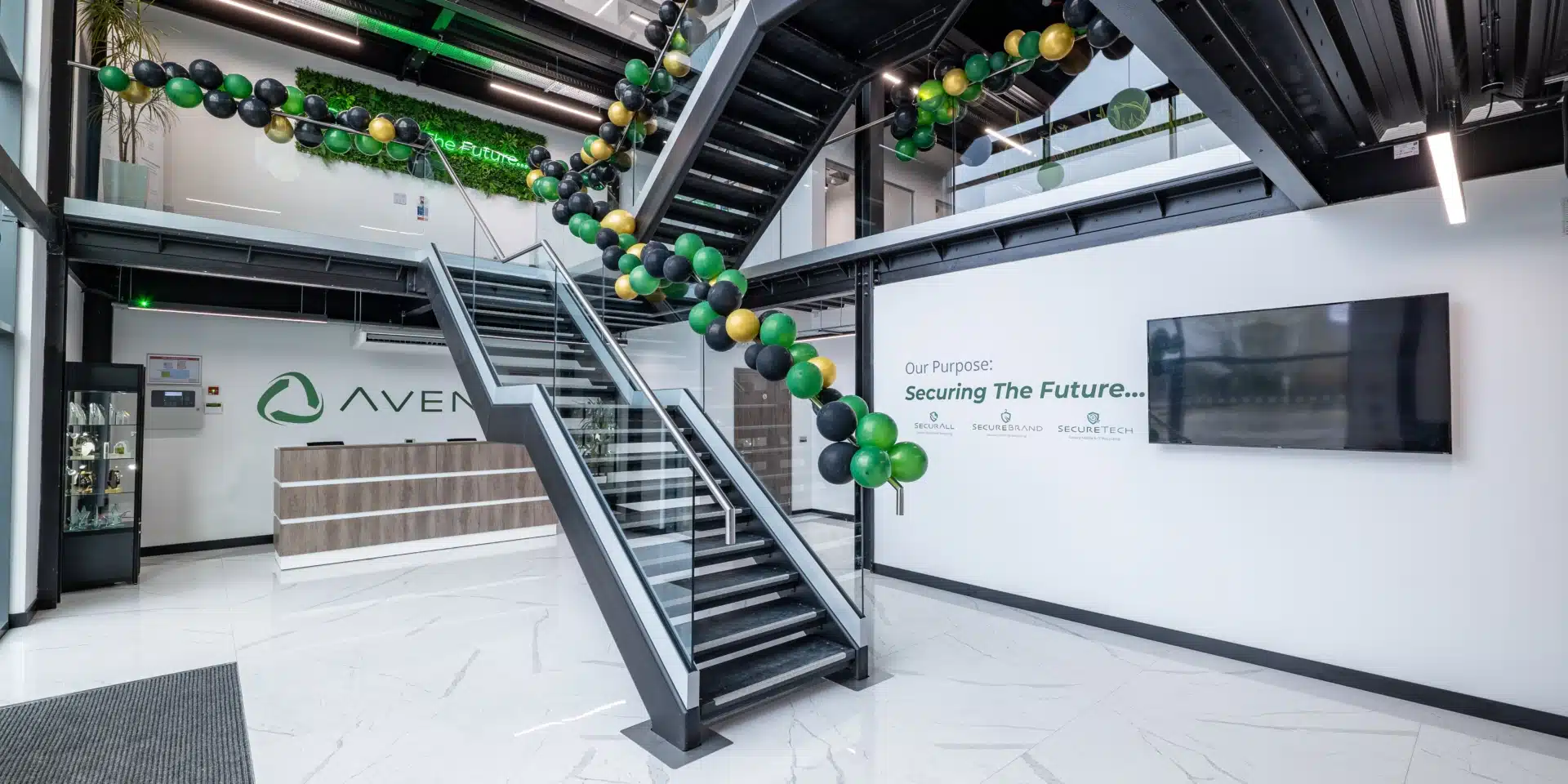 A reception room with an industrial style staircase in front.