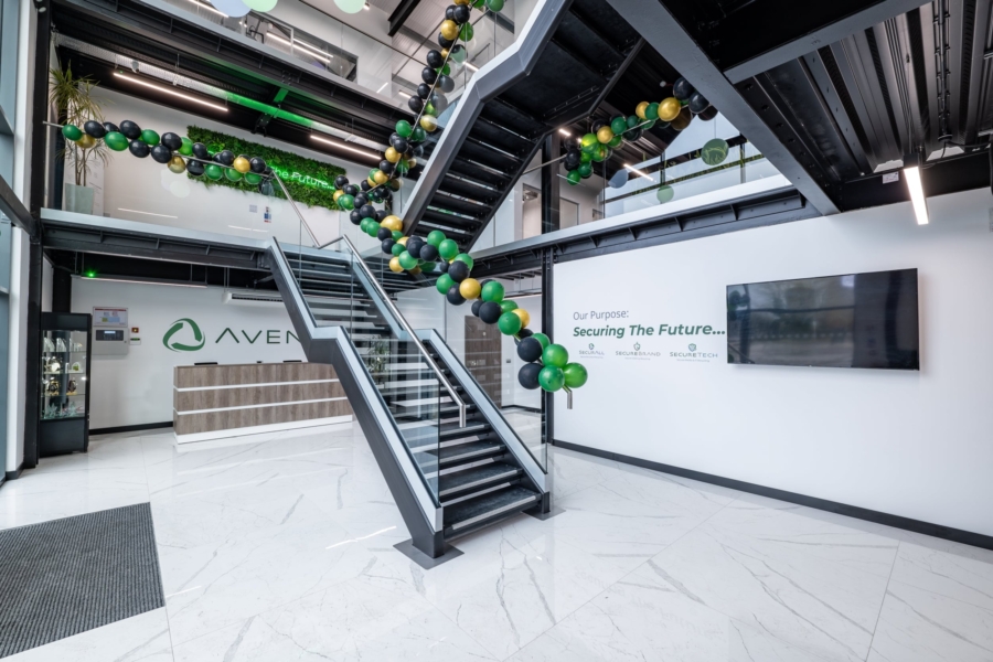 A reception room with an industrial style staircase in front.
