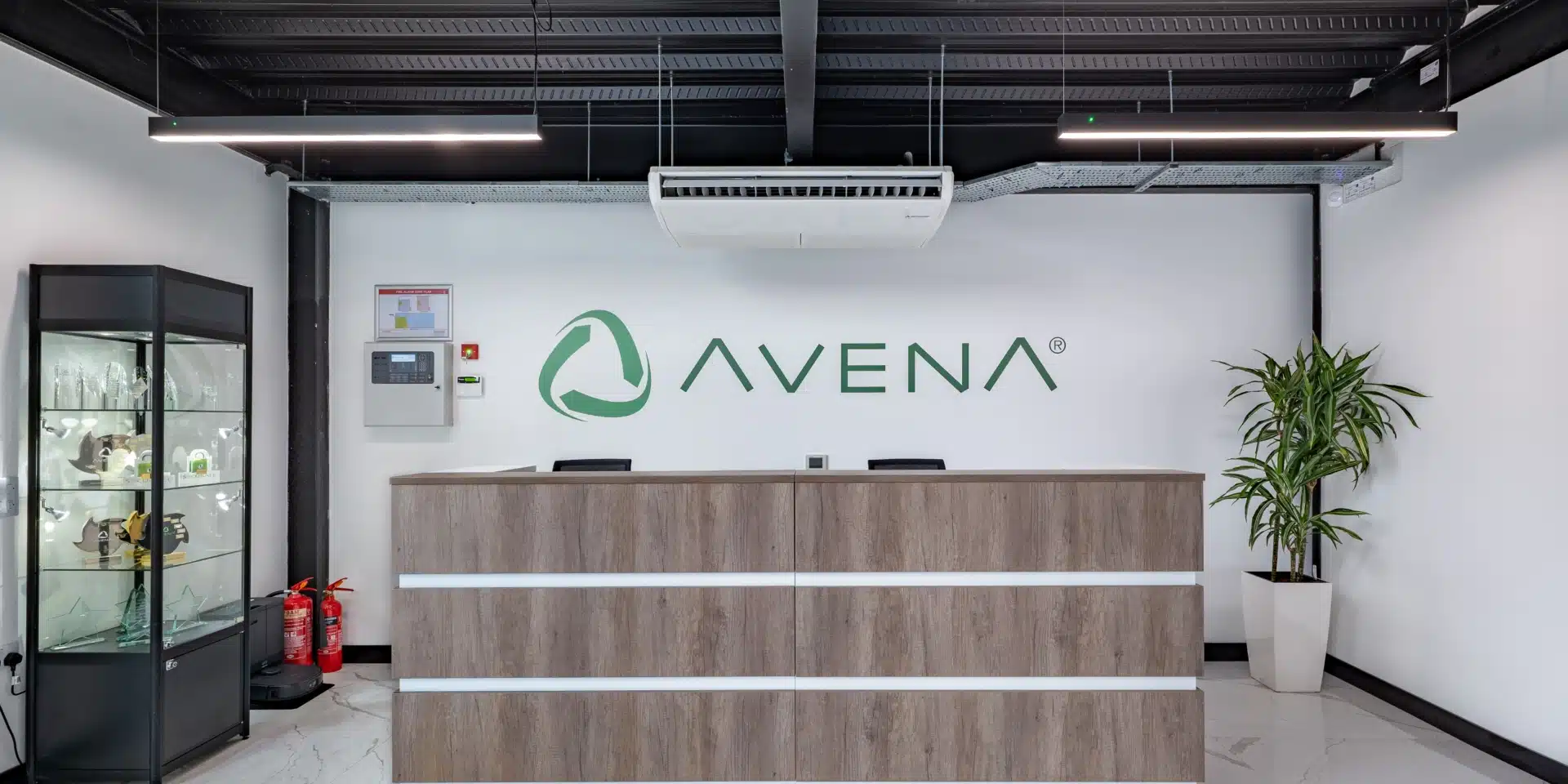 A reception room with a wooden desk.