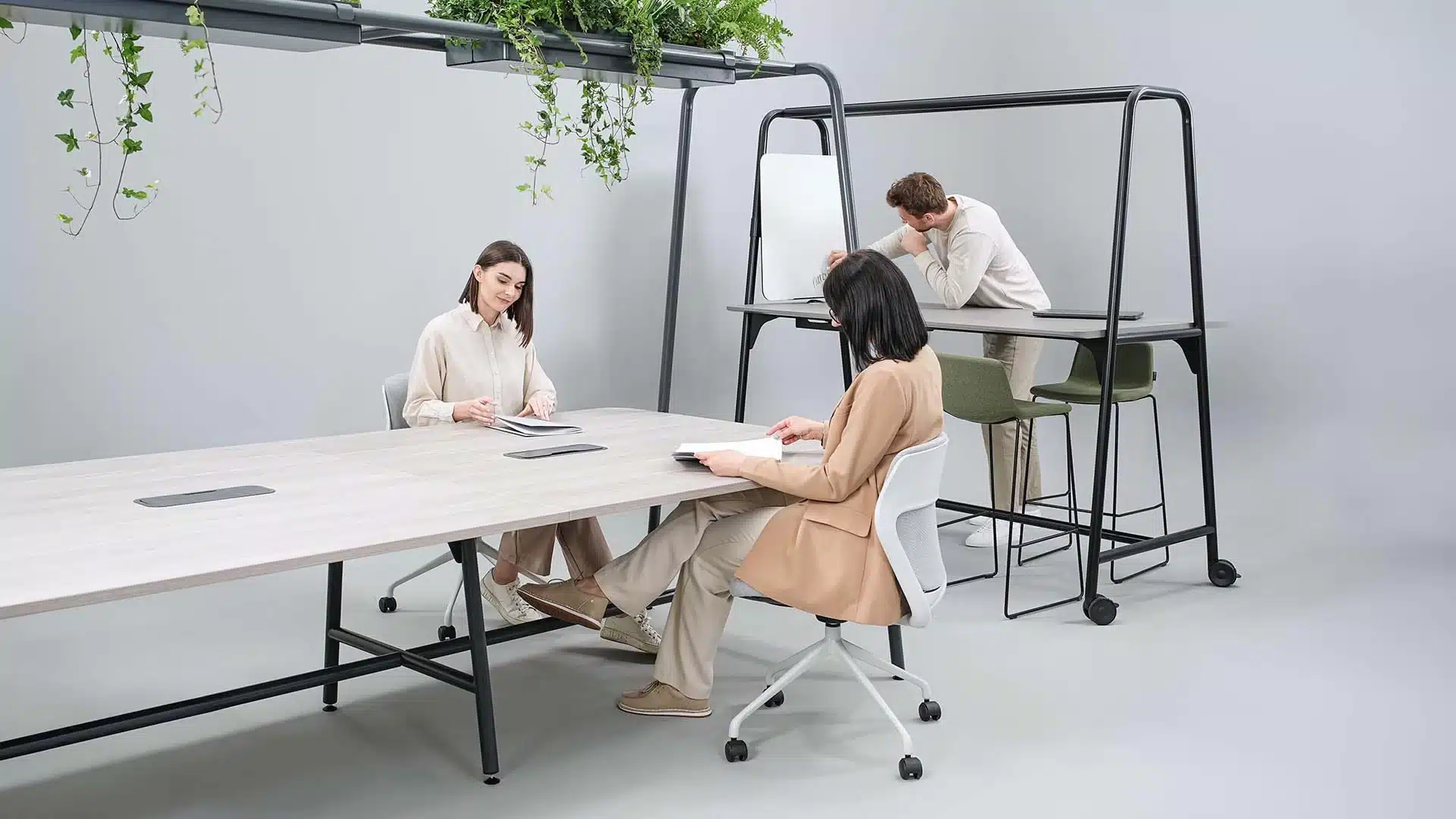 A room with a standard and high table with a green planter above.