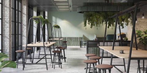 An industrial style room with high tables and planters above.