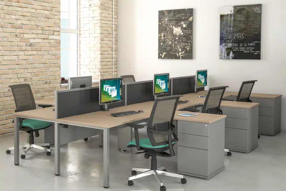 Wooden style office desks with black office chairs.
