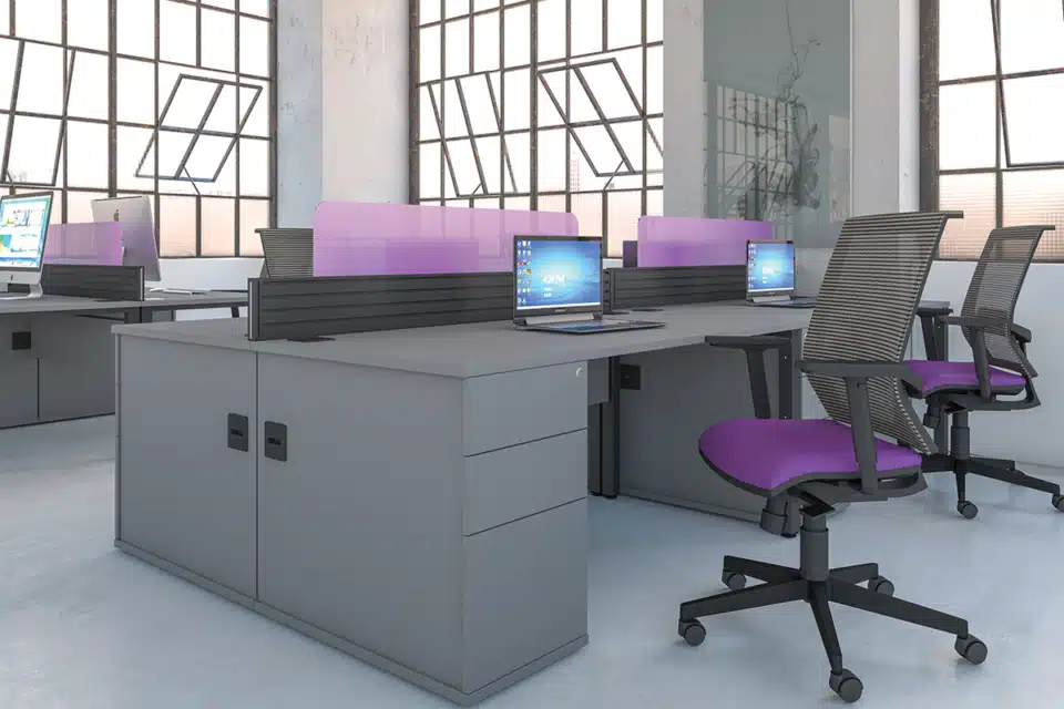 Grey bench desk with purple office chairs.