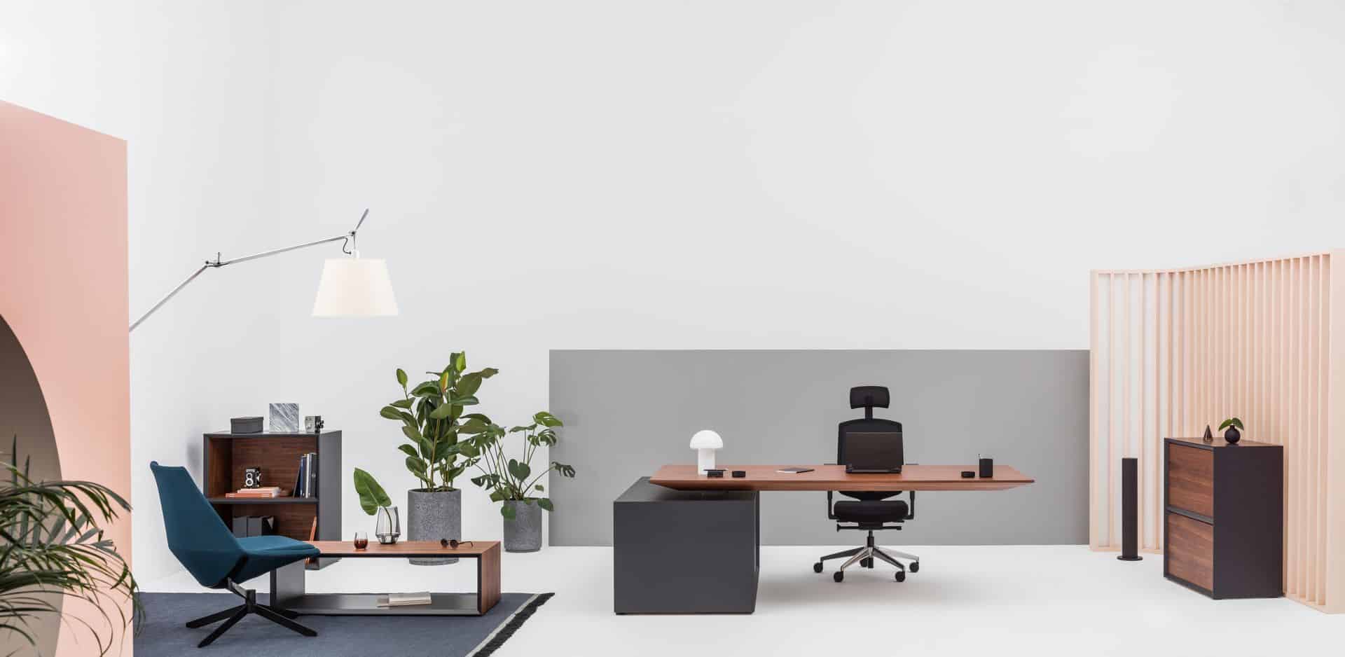 A large room with executive desk and chair.