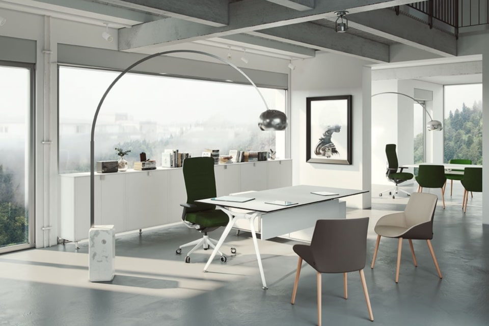 A large white executive table in a spacious room.