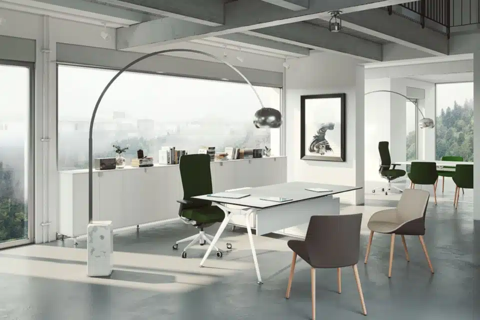 A large white executive table in a spacious room.