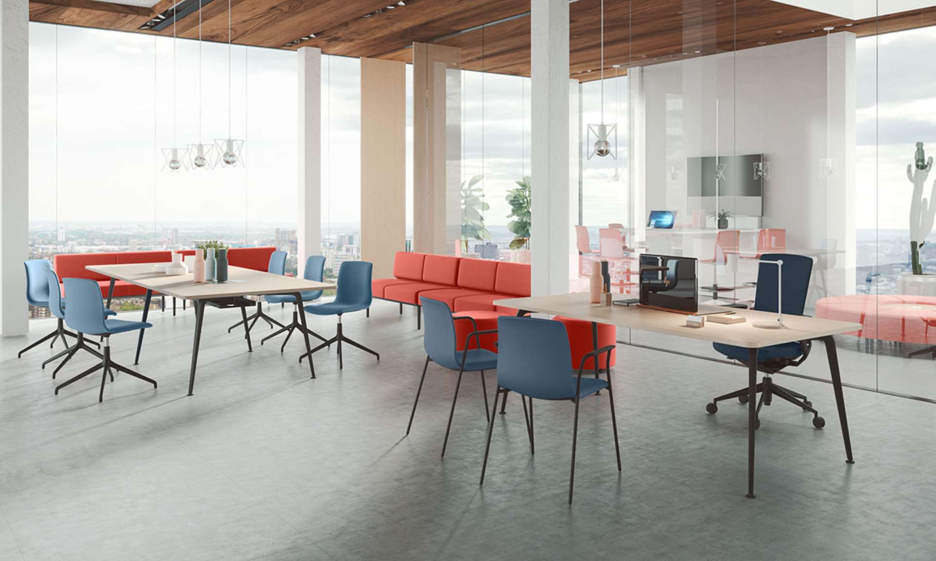A large room filled with modern desks and office chairs.