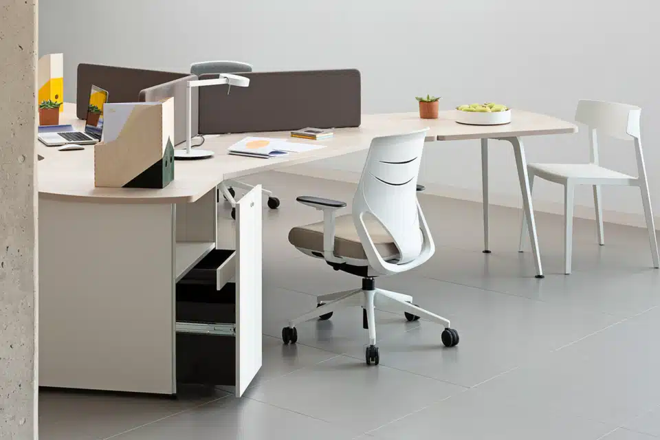 A grey room with a white office desk and a chair.