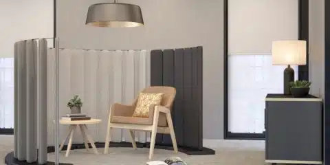 Black and white curved acoustic floor screens with lounge chairs.