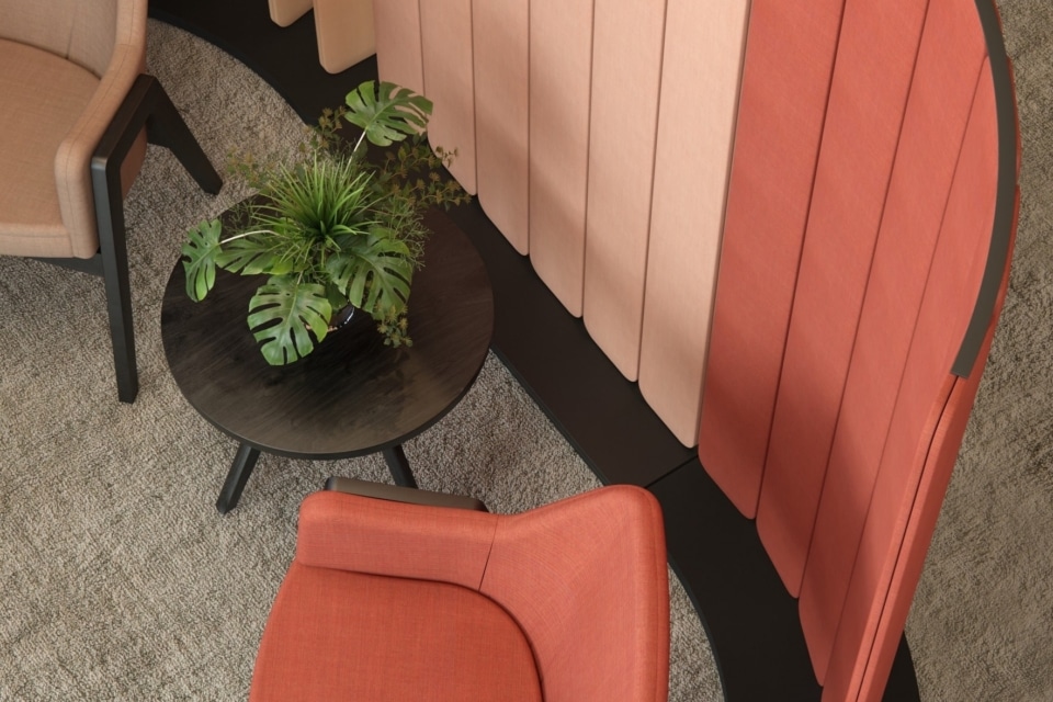 Colorful acoustic floors screens next to lounge chairs.