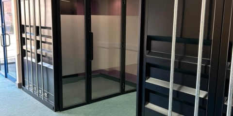 An office with large container style acoustic pods.
