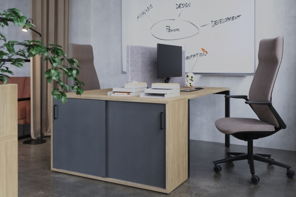 A storage locker system with planters and office chair.