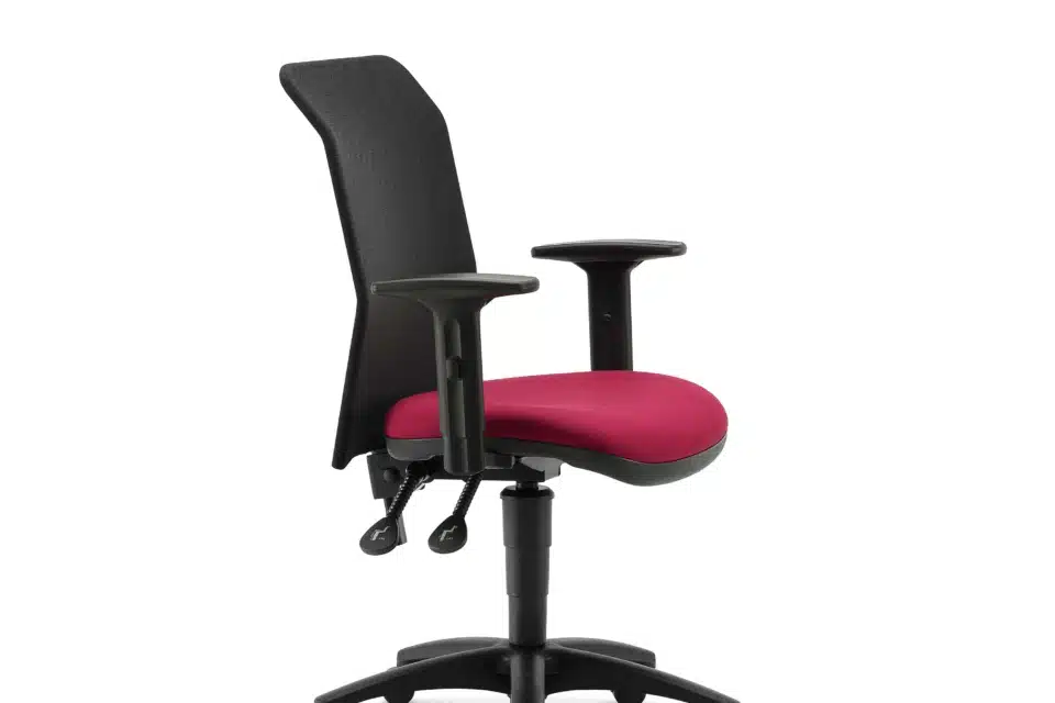 A black mesh chair with arms on a pink seat with white background.