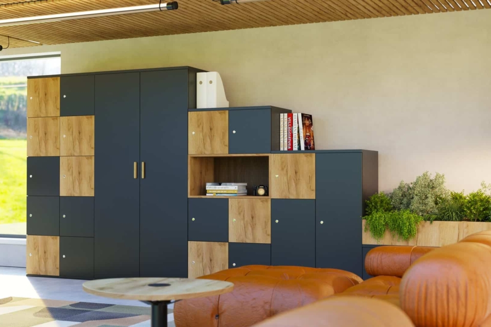 A modern room filled with numerous large, grey modular storage lockers arranged in rows.