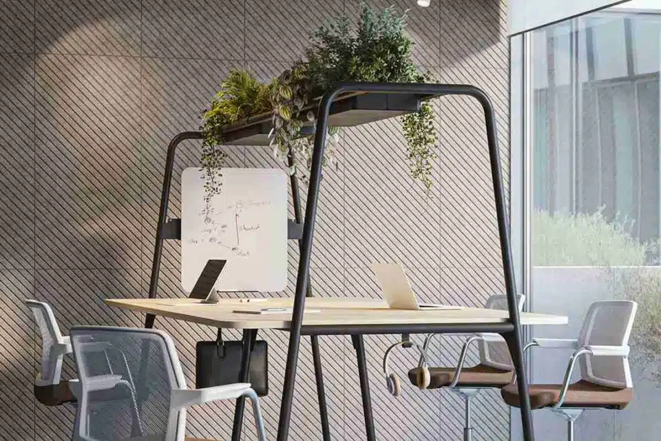 Narbutas ROUND Multipurpose Table in a modern office, showing its versatility as a high collaborative meeting table and individual workstation.