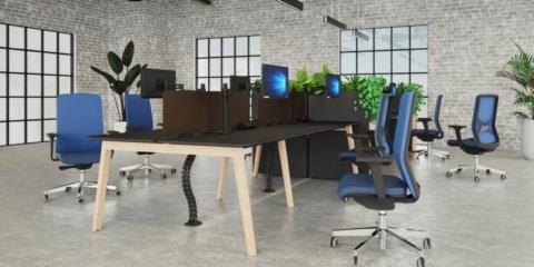 Kardo Boost power system and Desktop Power TI desk module integrated into a Nova-Wood desk, next to Metalicon Kardo Pole Mounted Twin Monitor Arms.