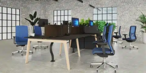 Kardo Boost power system and Desktop Power TI desk module integrated into a Nova-Wood desk, next to Metalicon Kardo Pole Mounted Twin Monitor Arms.