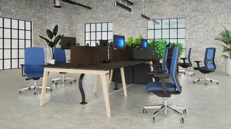 Kardo Boost power system and Desktop Power TI desk module integrated into a Nova-Wood desk, next to Metalicon Kardo Pole Mounted Twin Monitor Arms.