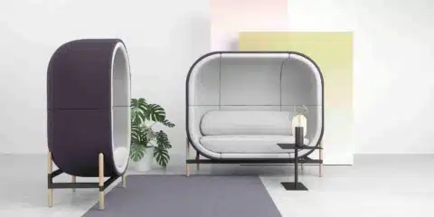 Casala Capsule acoustic office work pod, fully upholstered in blue and grey, in a modern open-plan office setting.