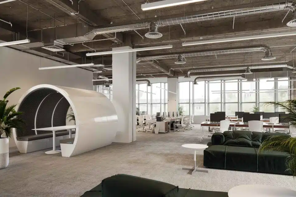 A modern, white soundproof meeting pod situated in a spacious, sunlit law firm office.