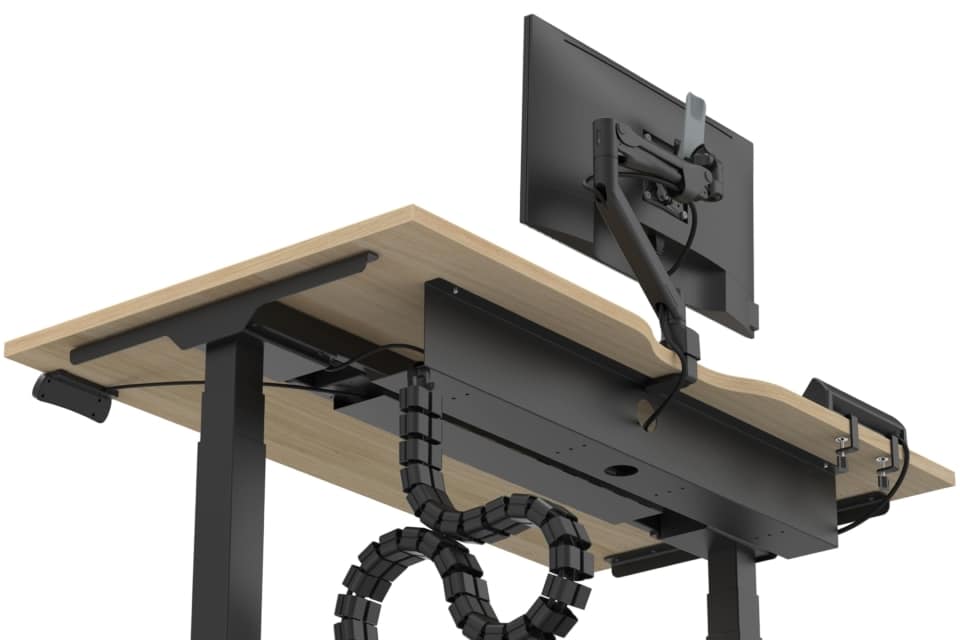 Underside of desk showing black cable tray and management spine.